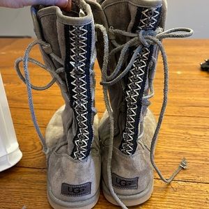 Size 7 UGG boots. Slip on style. With ties in the back.